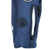 A close-up image of a dog walking bag with a built-in poo bag dispenser