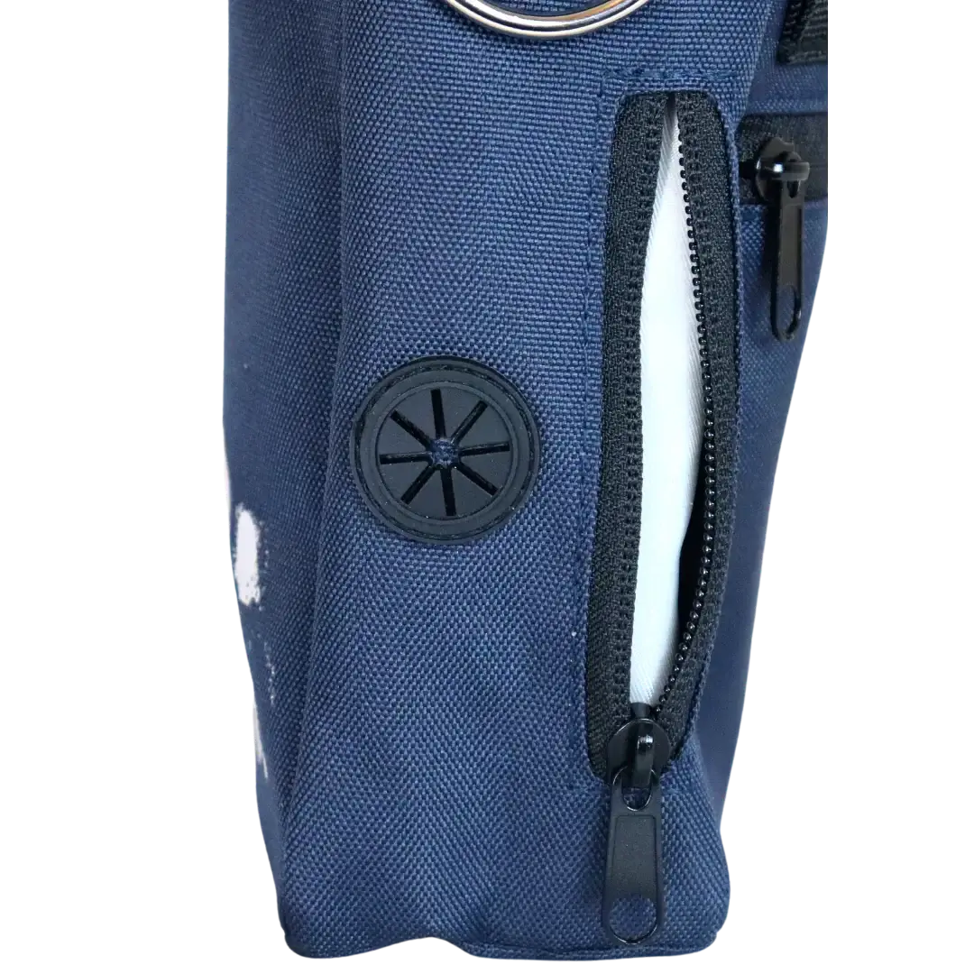 A close-up image of a dog walking bag with a built-in poo bag dispenser