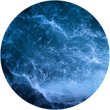 A circular image of a deep blue ocean.