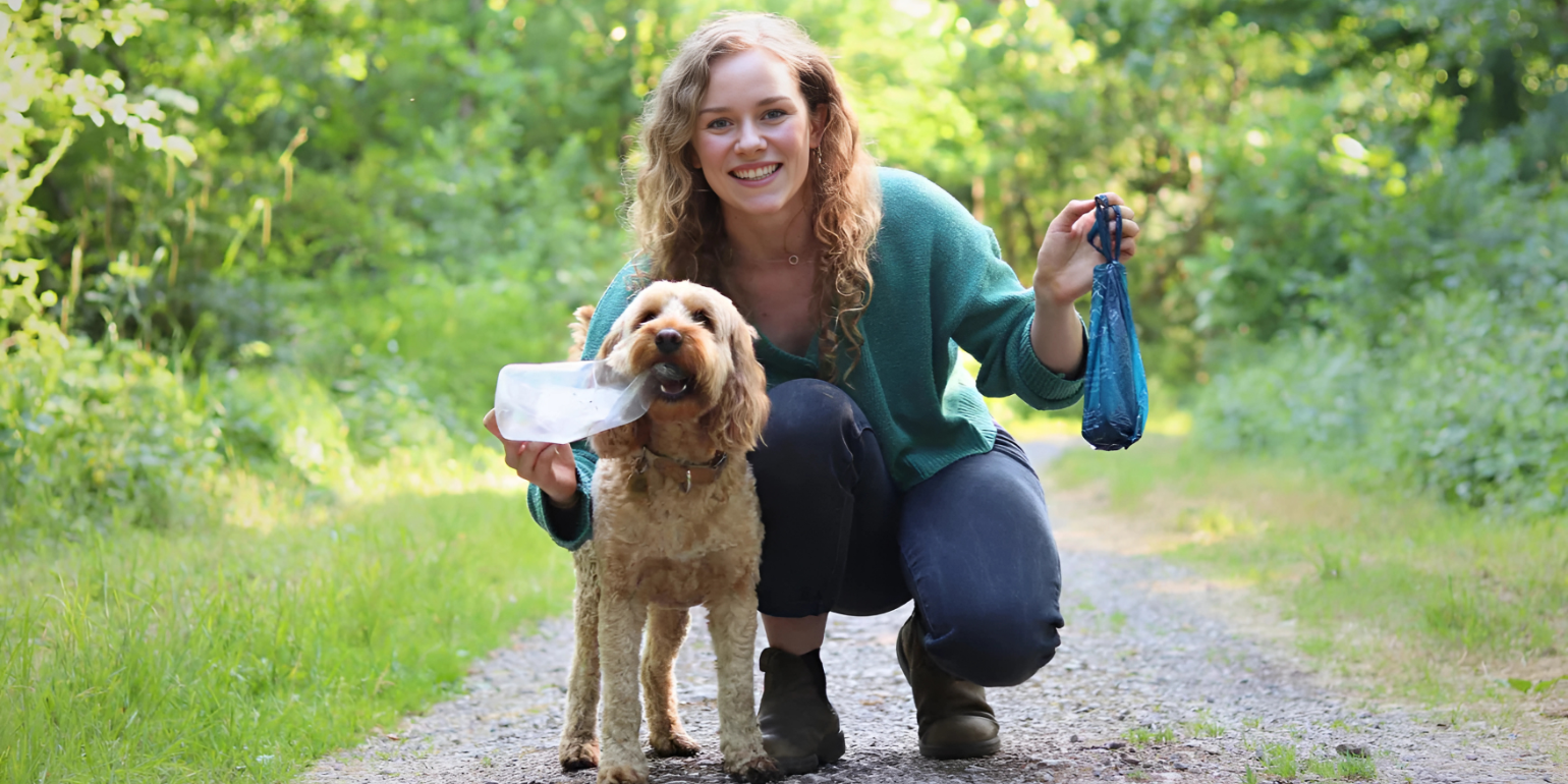 An image of Pet Impact's co-founder, Alice, with her dog, holding a ReSEAcled poo bag. 